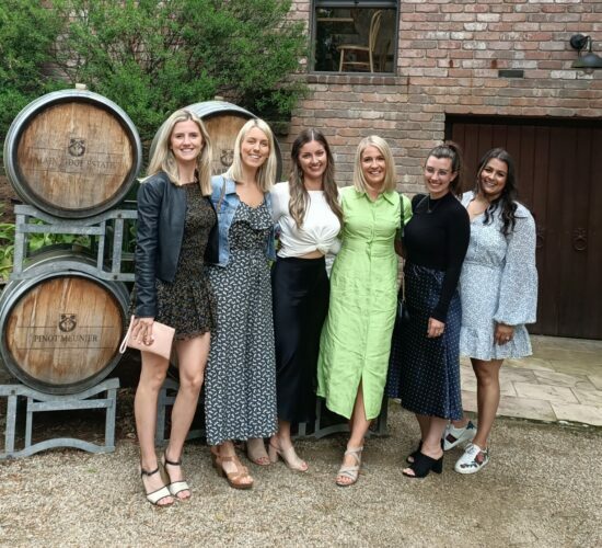 5 Girls In Front Of Wine Barrels During Their Healesville Wineries Tour