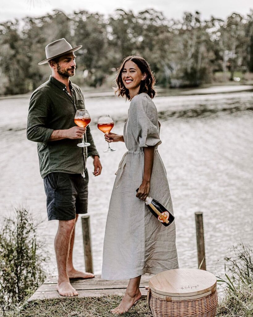 Couple With Wine Glasses And A Wine Bottle At Domaine Chandon On Their Private Couples Yarra Valley Winery Tour