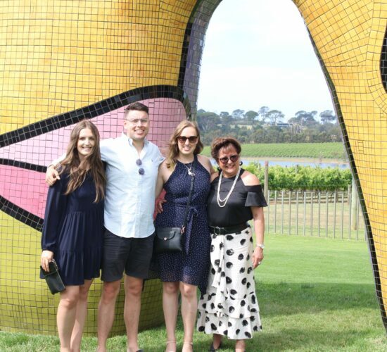 4 people on eye-catching vineyard on their Melbourne wine tours