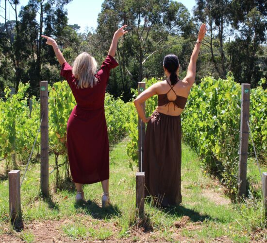 two girls at a beautiful vineyard