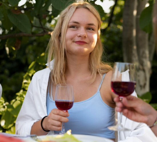 Close up woman holding wine glass
