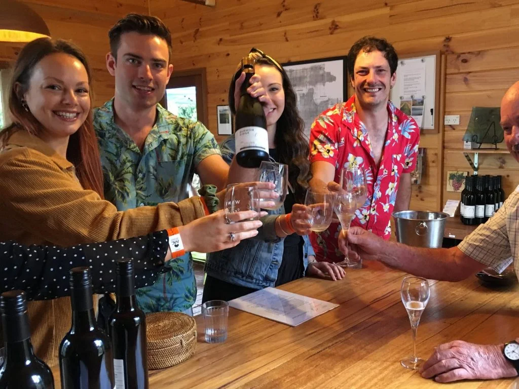Group Of Friends Tasting Wine At A Winery During Wine Tour In Geelong & Bellarine